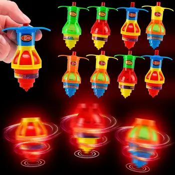 Los niños creativos brillantes y resplandecientes de rotación del giroscopio en la cadena de juguete, colorido giroscopio de eyección del cinturón lanzador